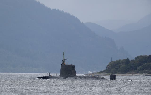 <p>As part of their roles, the workers are responsible for the movement of nuclear submarines in and out of ports (Andrew Milligan/PA)</p>