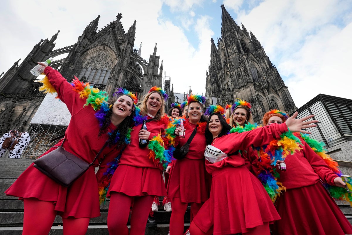 Carnival's women revelers take over the Rhineland for a day, dancing, drinking and kissing