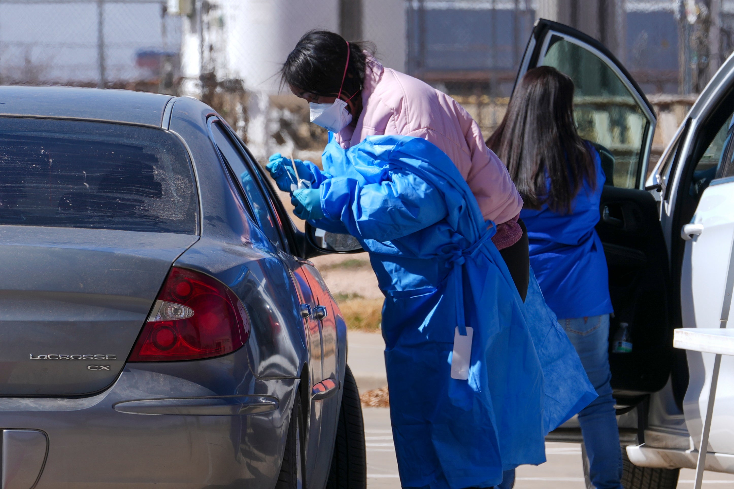 A health worker administers a measles test to a car passenger at a mobile testing site outside Seminole Hospital District Friday, February 21, 2025, in Seminole, Texas. Many of the infected in the latest outbreak were unvaccinated