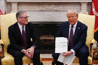 President Donald Trump shows the assembled media a letter from King Charles III inviting him on a state visit to the U.K.