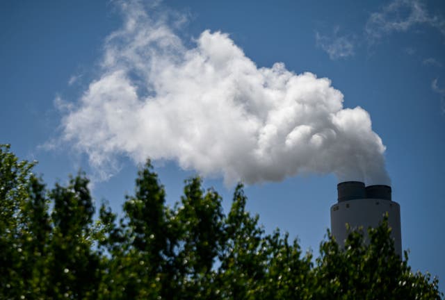 <p>Steam rises from an Alabama coal plant. Coal production produces the greenhouse gas methane, which warms the planet. Now, the Senate has voted to reverse an EPA rule that limits those emissions, requiring companies to pay a fine</p>