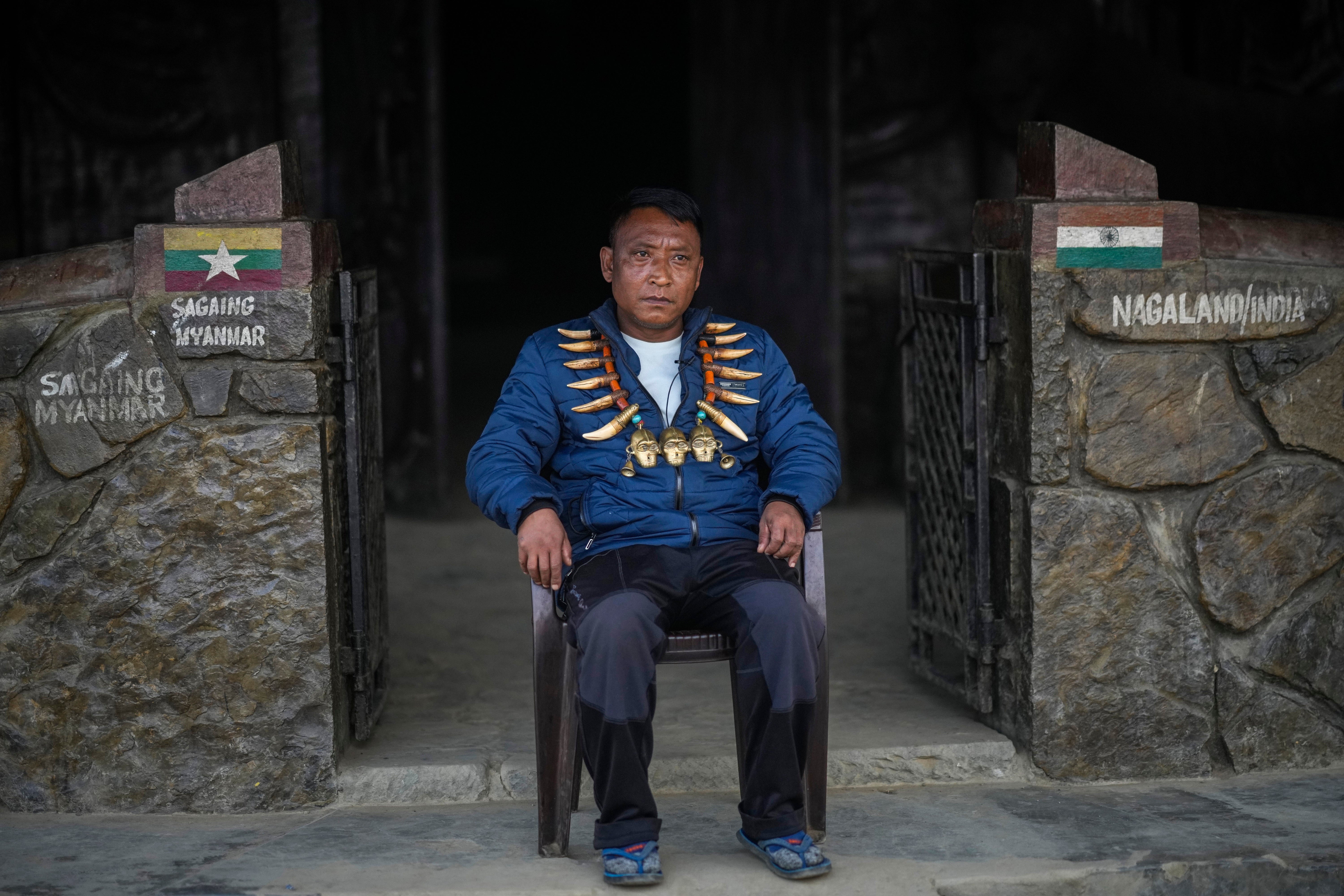 Tonyei Phawang, the Angh, or chief, sits in the entrance of his house