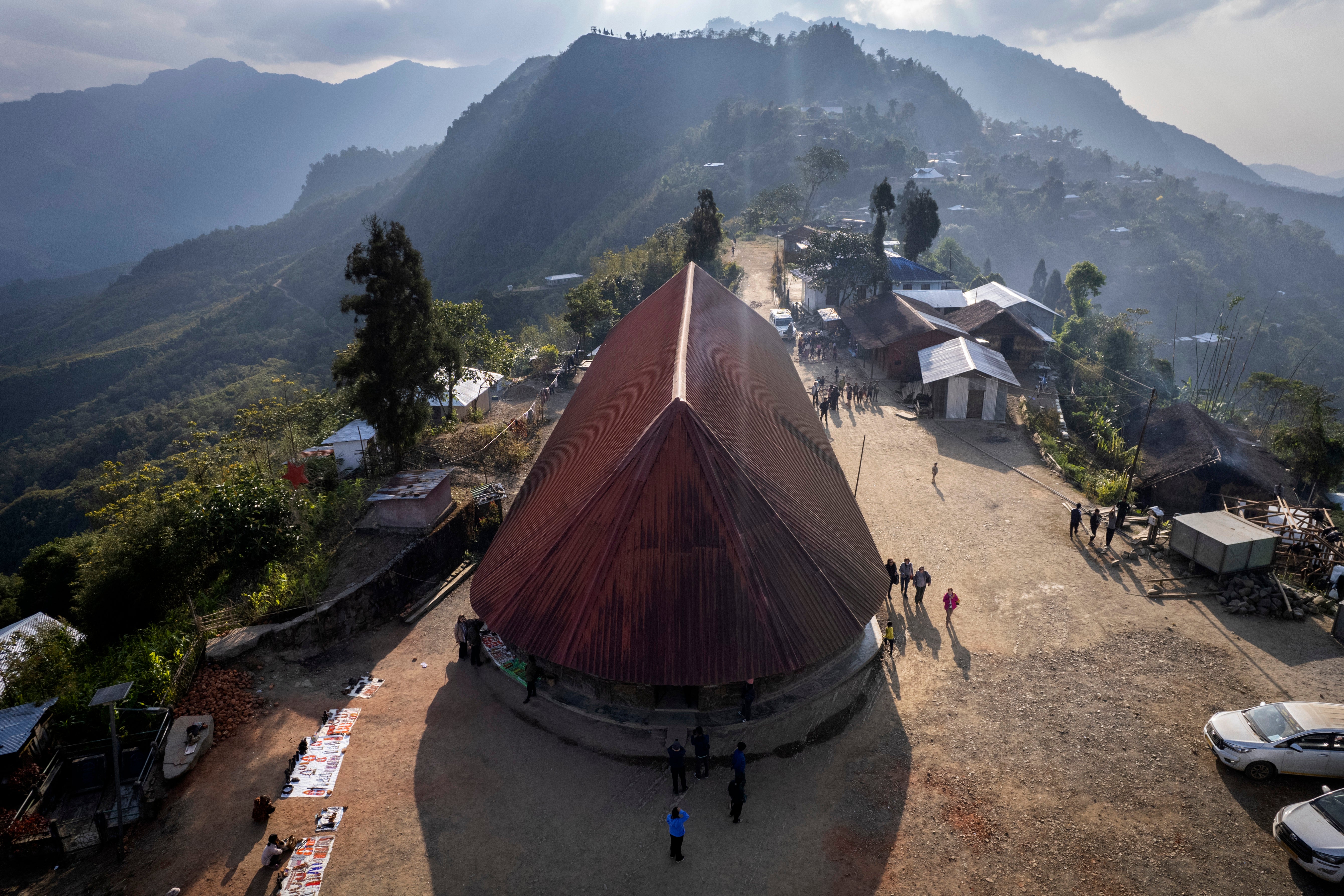 The red roof of the hut belonging to the Angh, or tribal chief