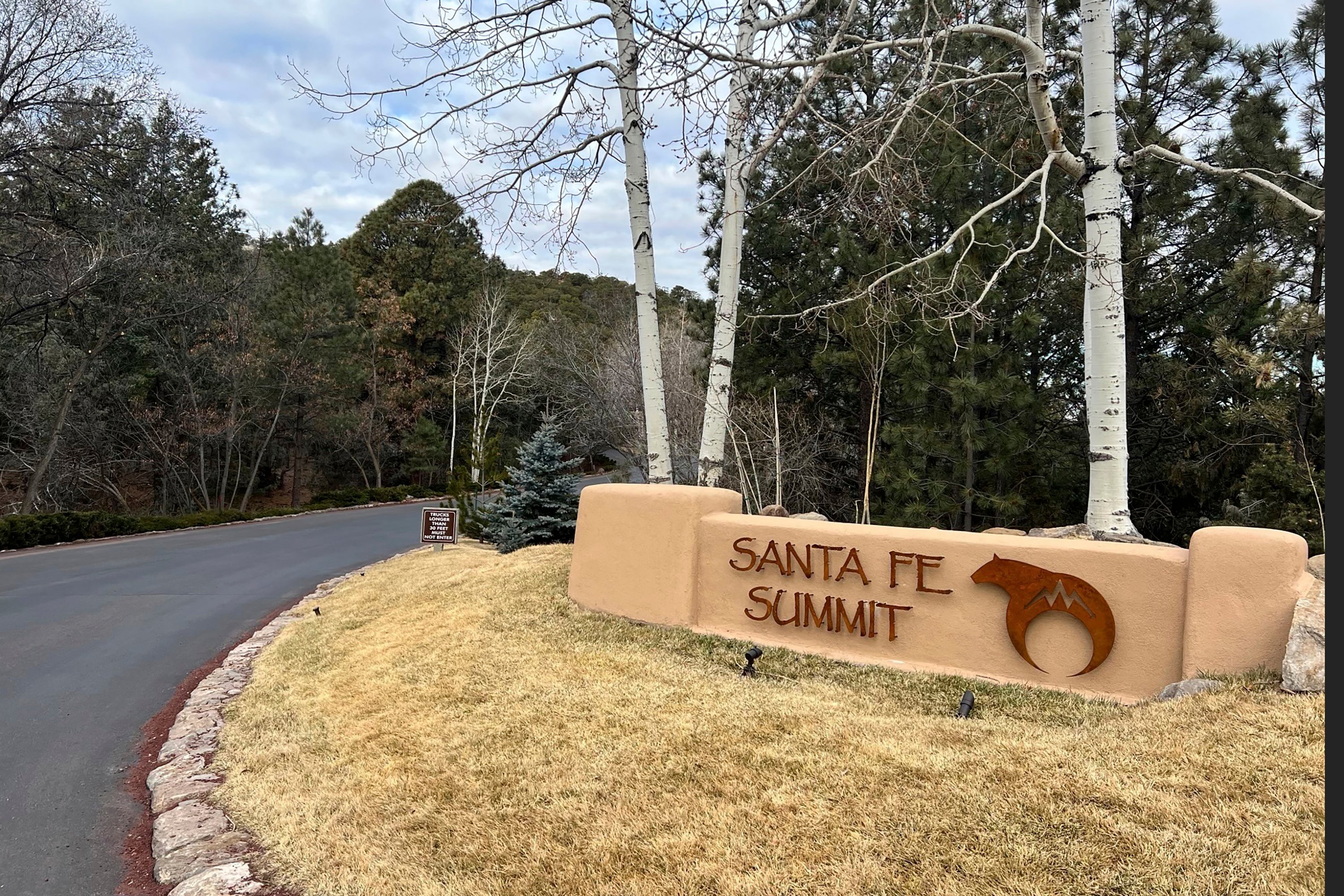 The entrance to the gated community where Hackman, his wife Betsy Arakawa and their dog were found dead