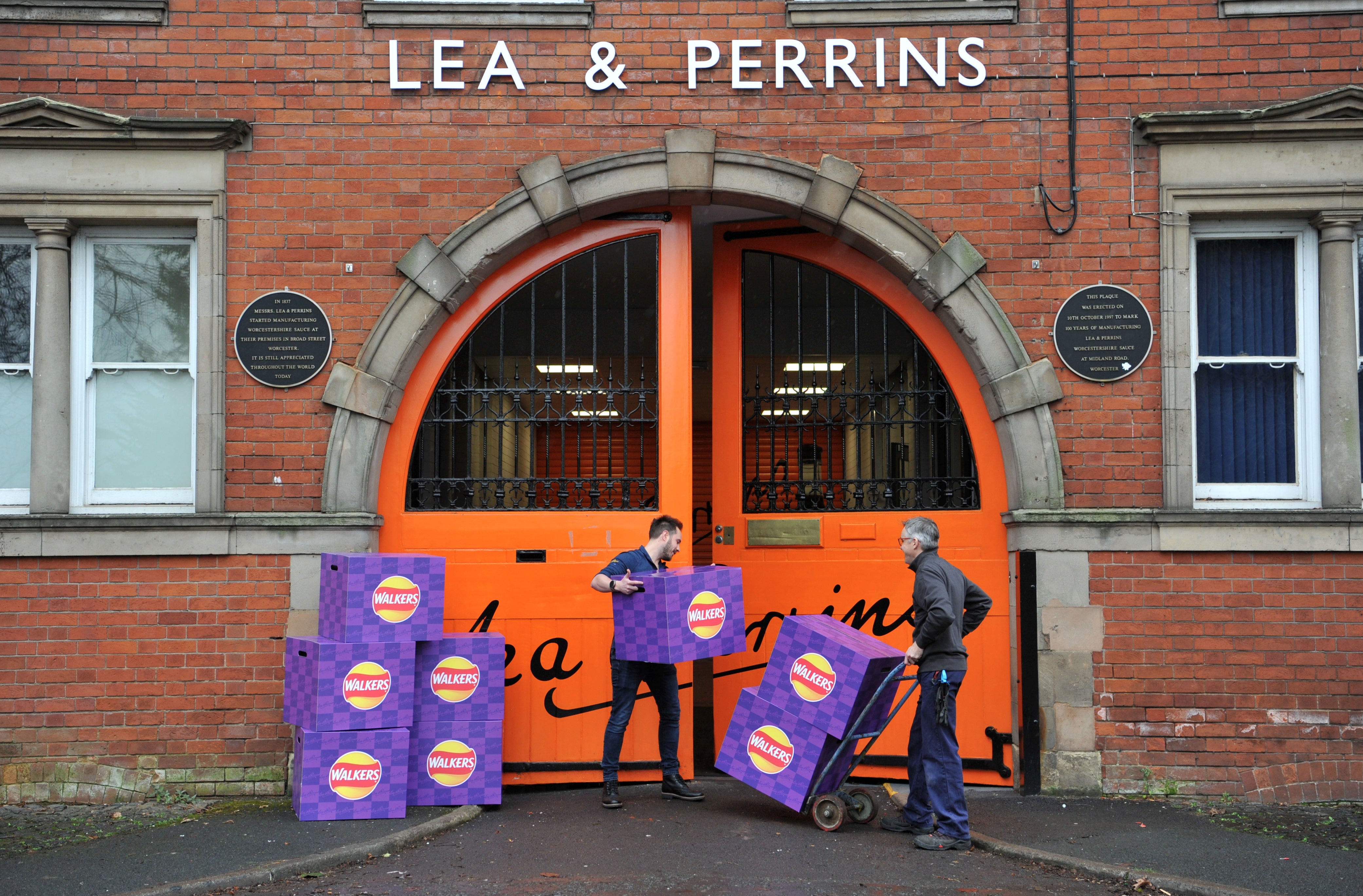 Boxes of Walkers Worcester Sauce crisps are handled outside the Lea & Perrins factory on Midland Road