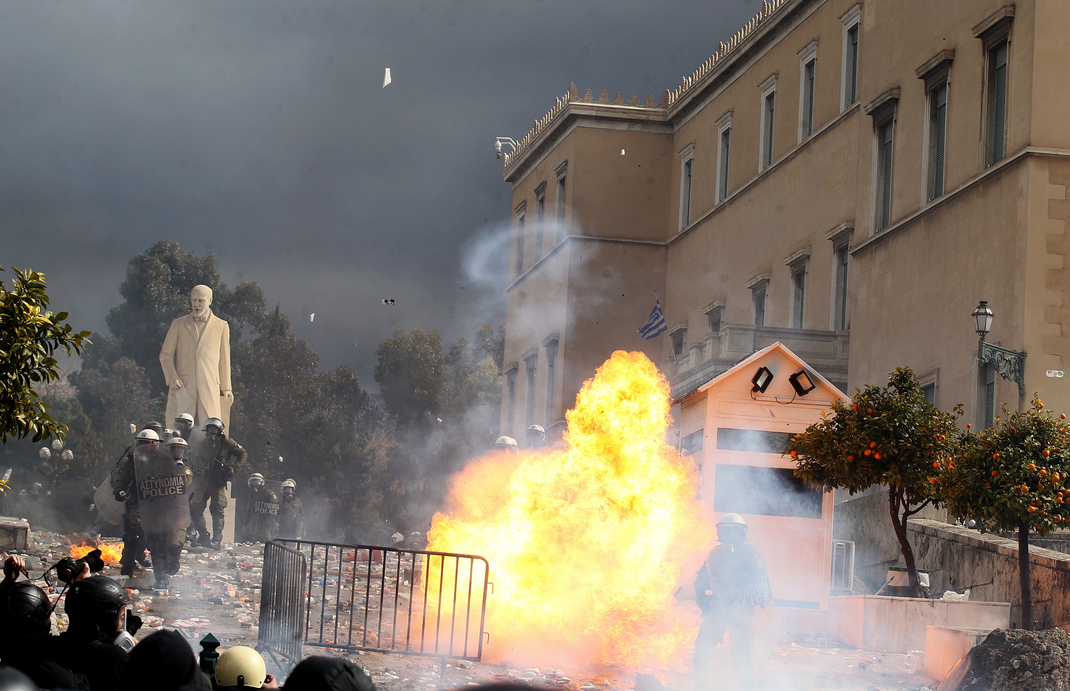 Protesters clash with riot police officers in front of the parliament, on the sidelines of a rally and a 24-hour nationwide strike marking the two-year anniversary of the Tempi train crash, in central Syntagma Square, in Athens, Greece, 28 February 2025. Mass demonstrations took place across Greece to demand justice for the victims, two years after a passenger train and a freight train collided in the municipality of Tempi, northern Thessaly region on 28 February 2023, killing at least 57 people. EPA/ALEXANDROS VLACHOS