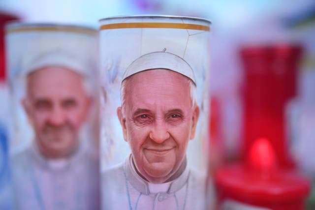 <p>Candles for Pope Francis are seen outside Rome’s Gemelli hospital on Friday</p>