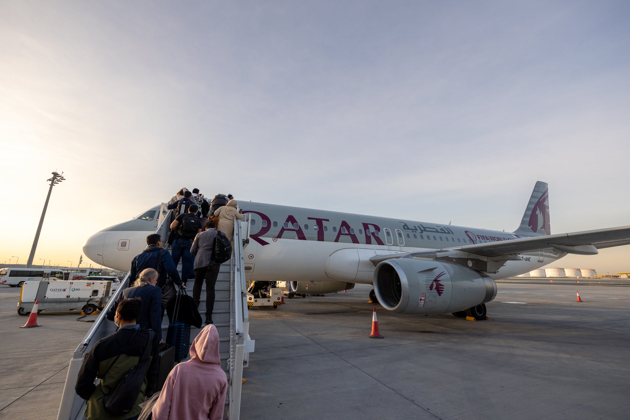 Passengers board an Qatar Airways plane at Hamad International Airport in Doha, Qatar (stock image)