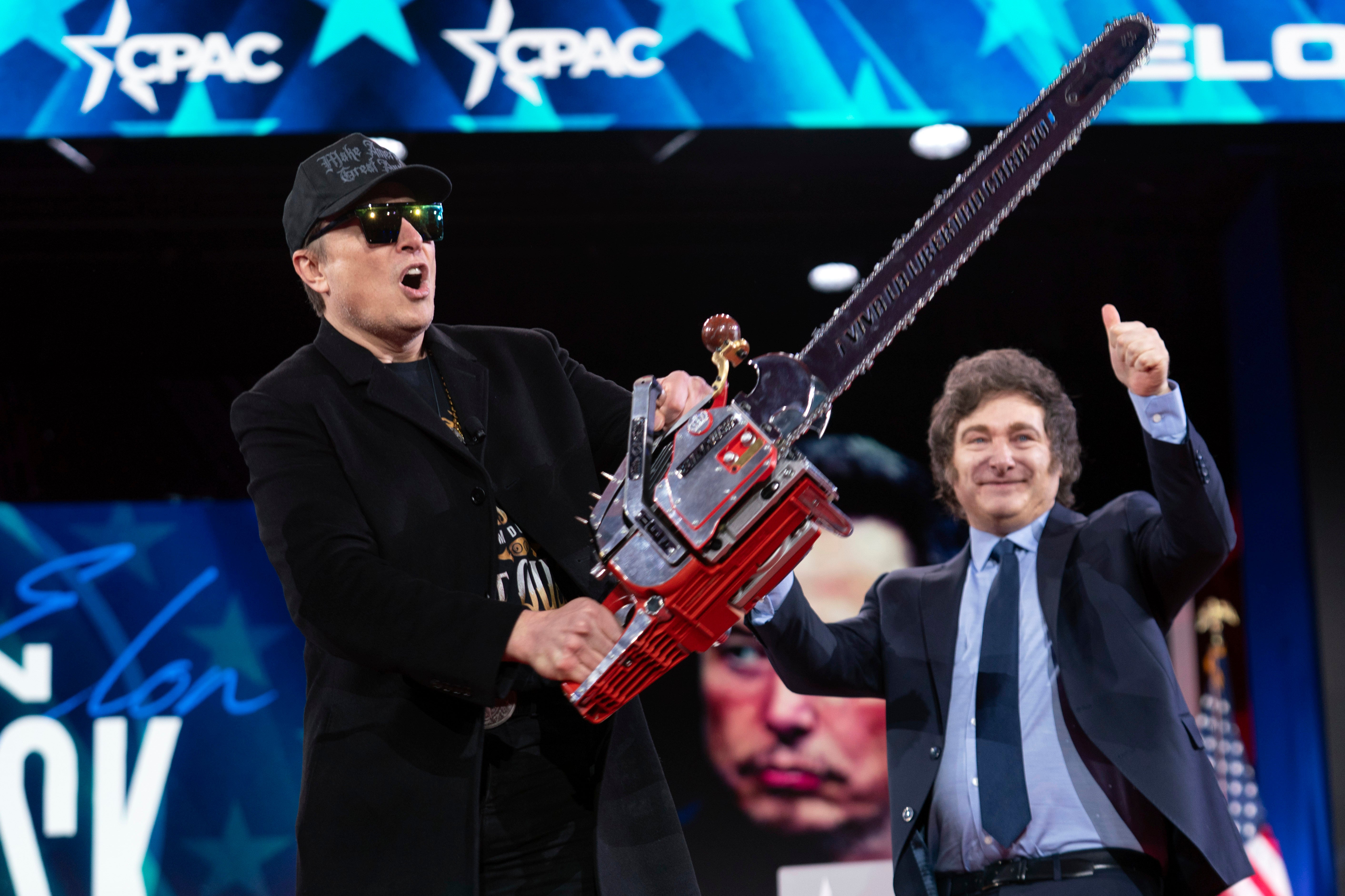 Elon Musk brandished a chainsaw at a conference in Washington