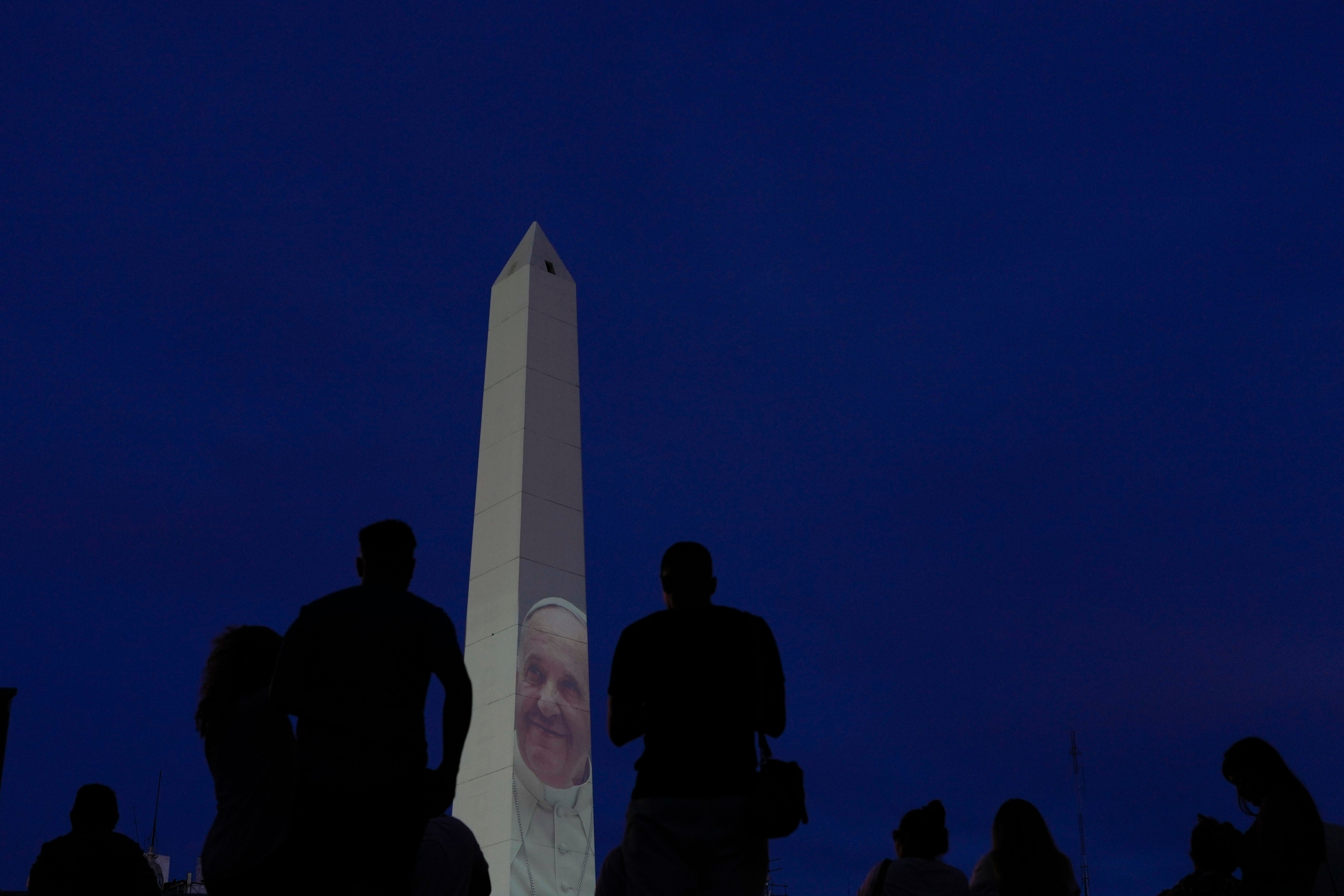 A photo of Francis is projected onto the Obelisco de Buenos Aires as he battles pneumonia in hospital