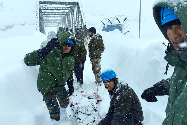 <p>Rescuers carry out an operation after Border Roads Organisation (BRO) workers got trapped under an avalanche near Mana village in Chamoli district of India's Uttarakhand state</p>