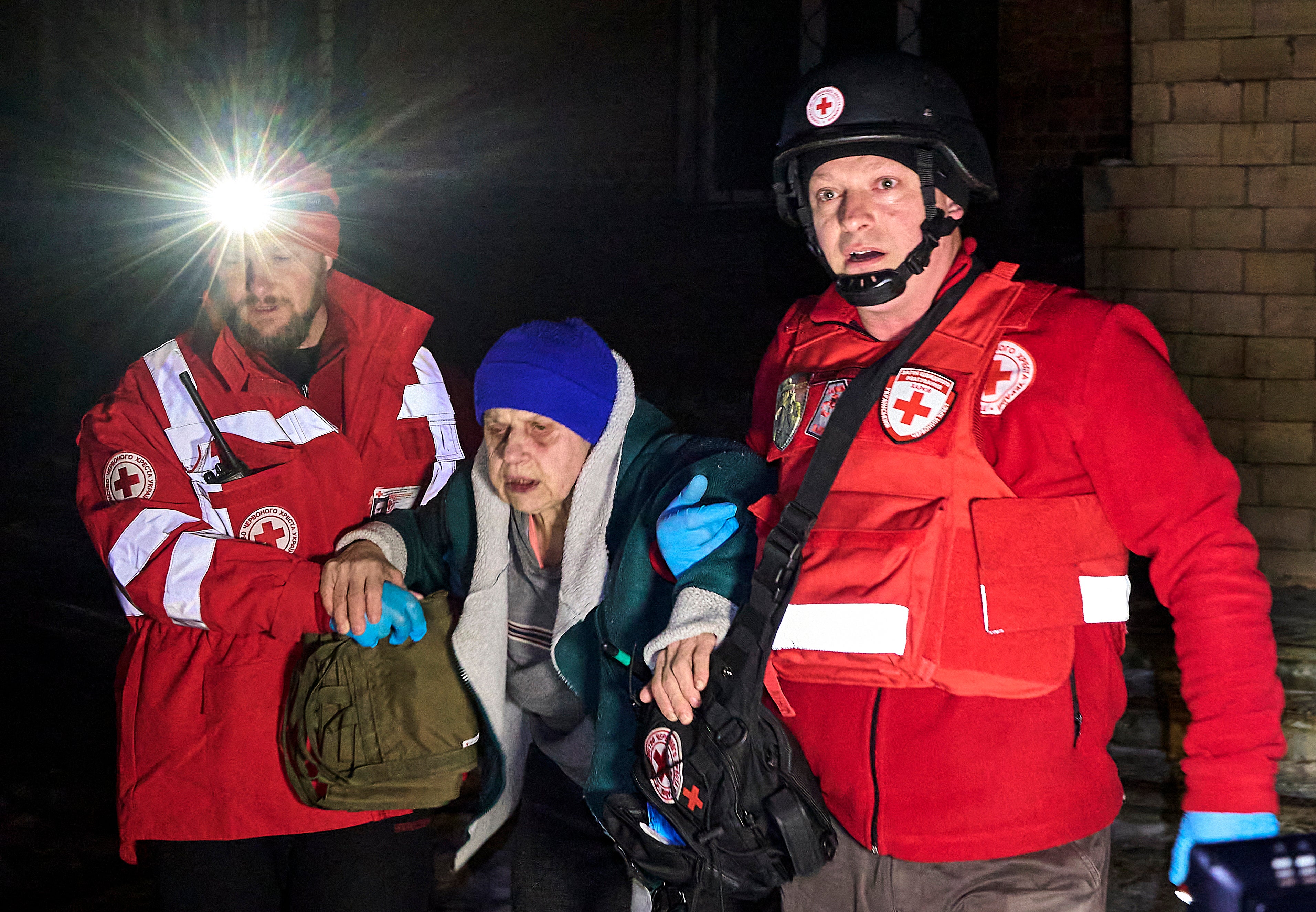 Ukrainian rescuers evacuate patients from a damaged clinic following a drone attack in Kharkiv, Ukraine