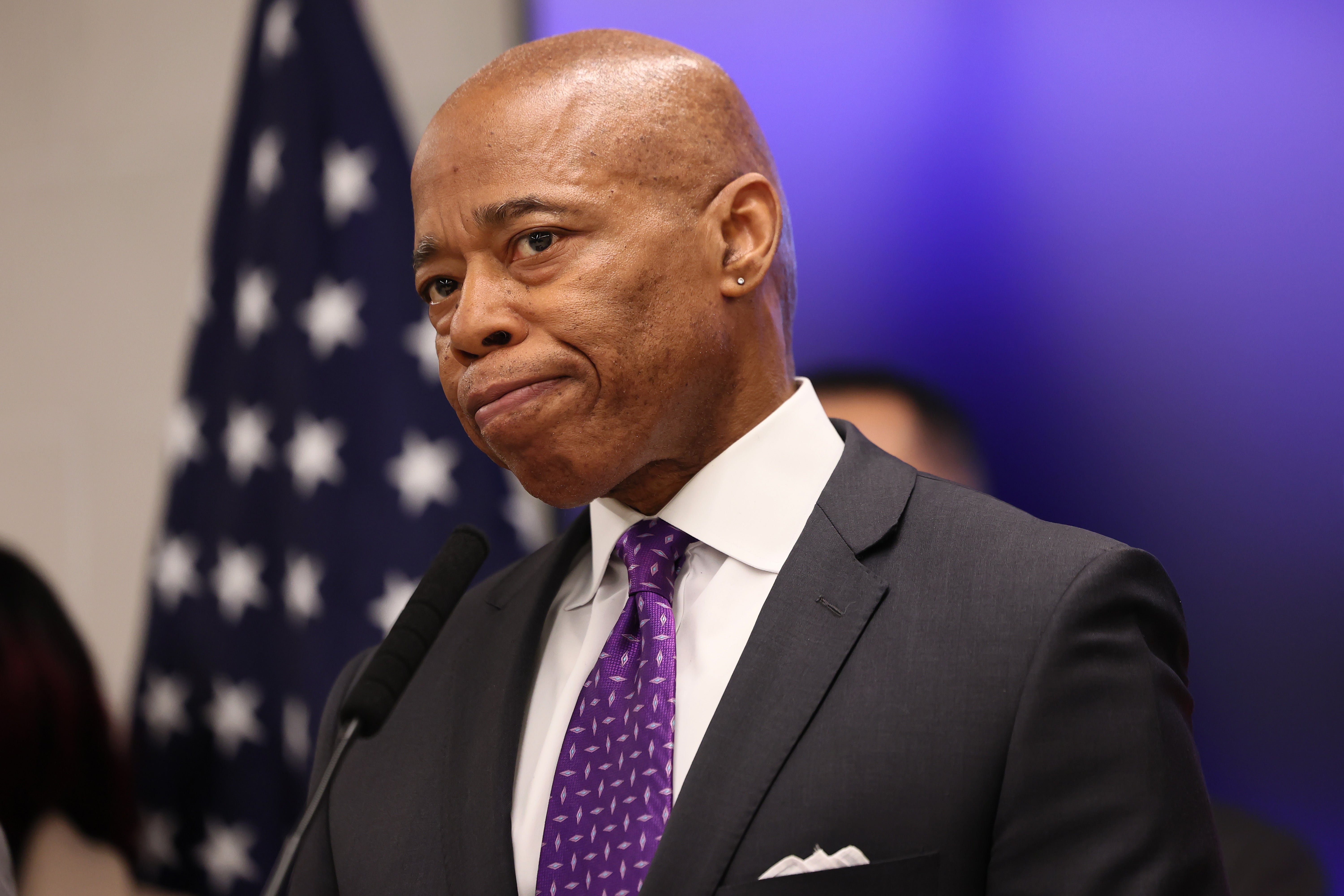 New York Mayor Eric Adams listens to questions from reporters during a press conference at NYPD's 40th Precinct on February 20, 2025 in New York City. The city government has sued the Trump administration for the return of $80 million