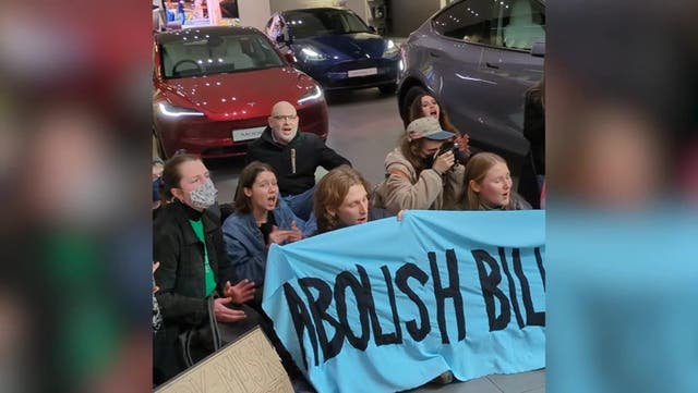 <p>Elon Musk climate protesters removed from London Westfield Tesla showroom by security .</p>