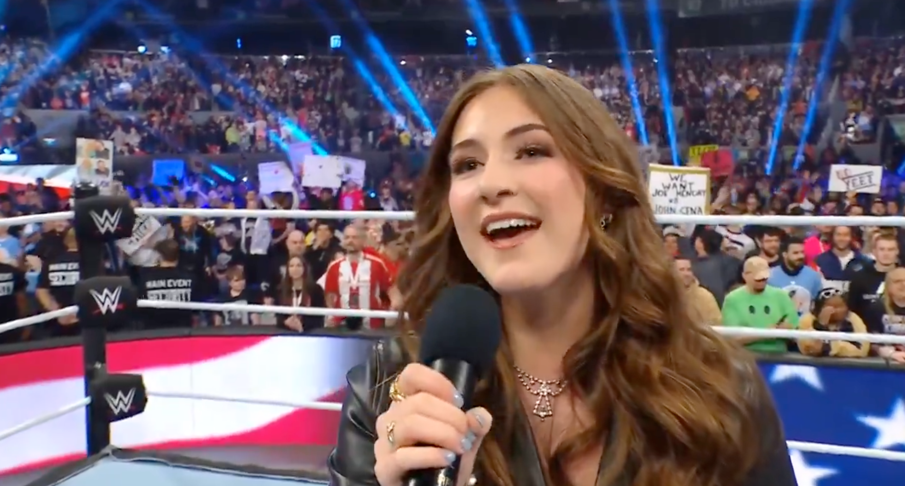 <p>Elizabeth Irving sings the US national anthem at WWE Elimination Chamber</p>