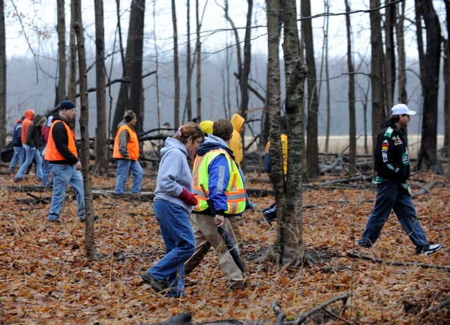 <p>Volunteers and rescuers search for 9-year-old Andrew, 7-year-old Alexander and 5-year-old Tanner Skelton in Morenci, Mich. on Tuesday, Nov. 30, 2010</p>