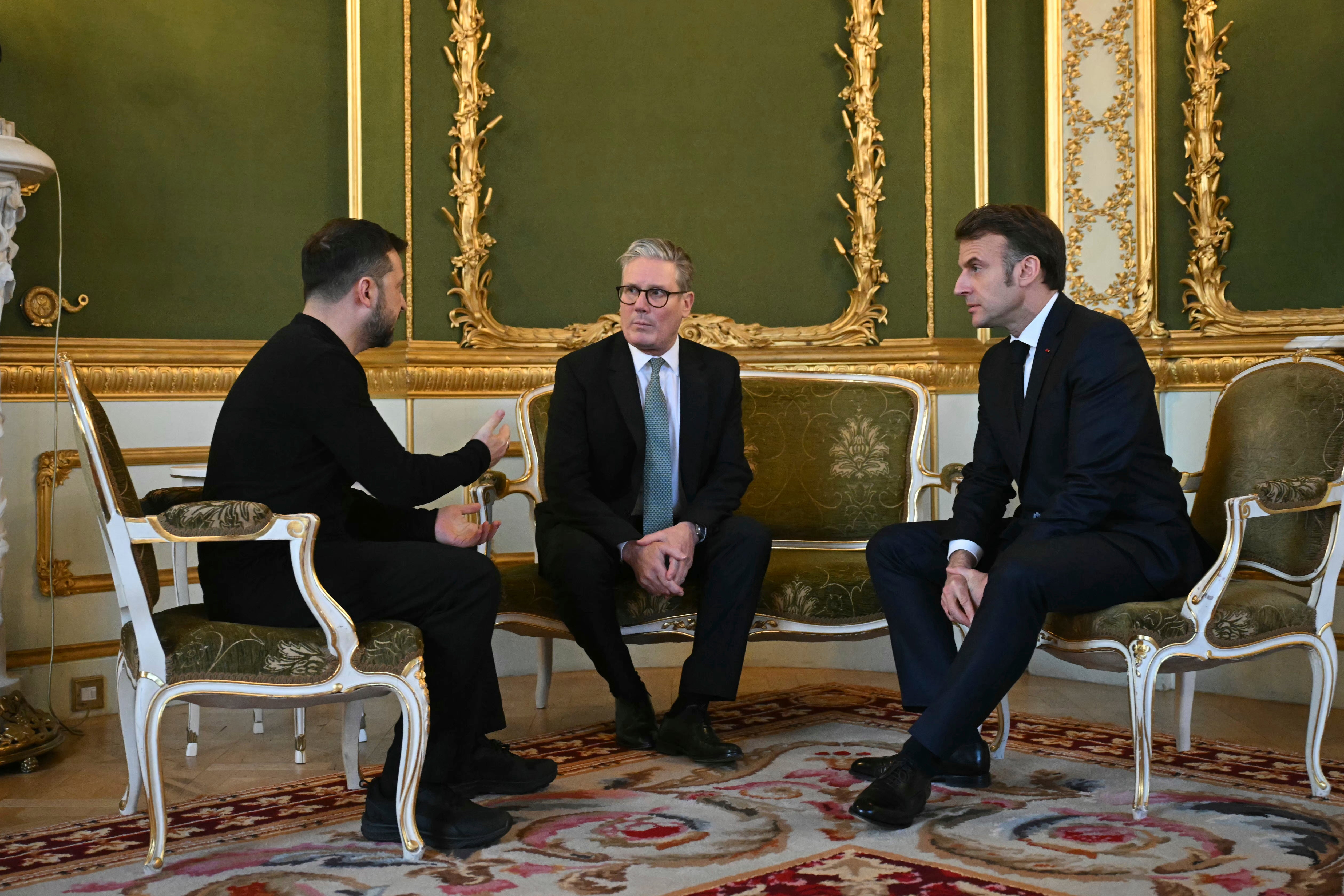 Prime Minister Keir Starmer, center, Ukraine's President Volodymyr Zelensky, left, and France's President Emmanuel Macron meet to discuss Ukraine