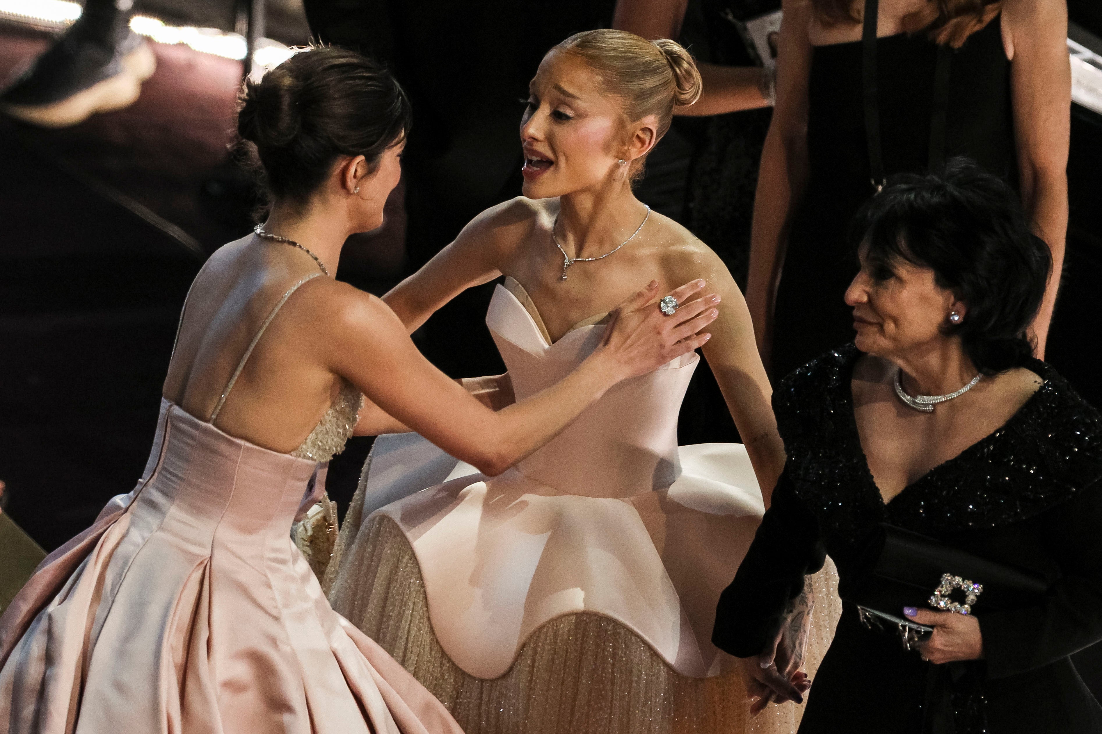Grande mingled with other stars in the show showing off her dress as she walked the theater