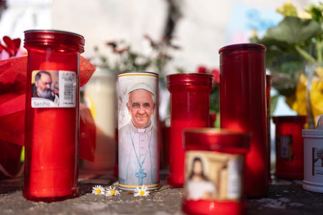 <p>Candles outside the Gemelli clinic where the Pope is being treated</p>