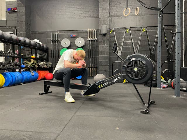 <p>Fitness writer Harry Bullmore after trying Olympic silver medallist and 2023 BMX freestyle world champion Kieran Reilly's go-to rowing machine workout</p>