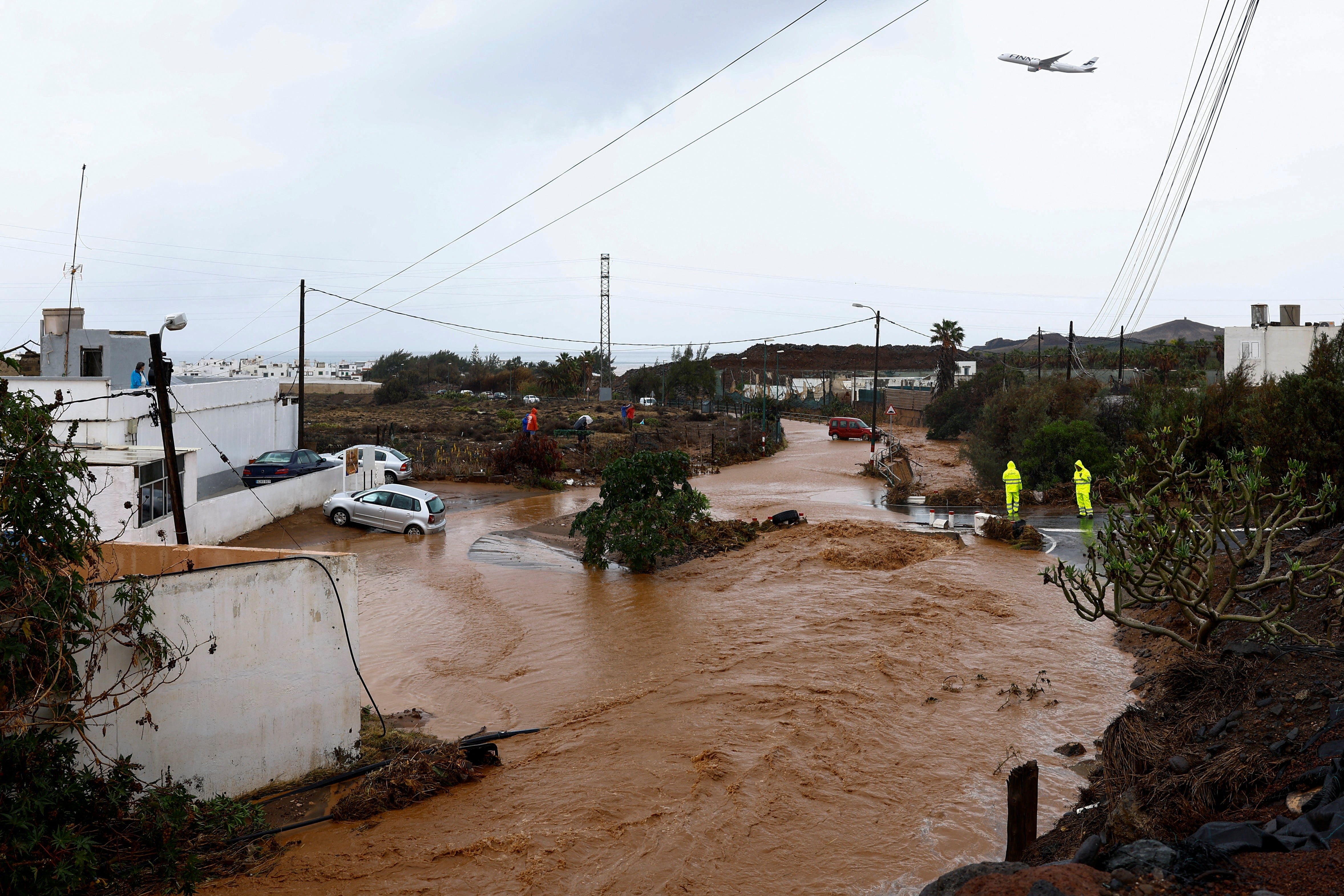 Rainwater runs down the Ojos De Garza ravine in Telde