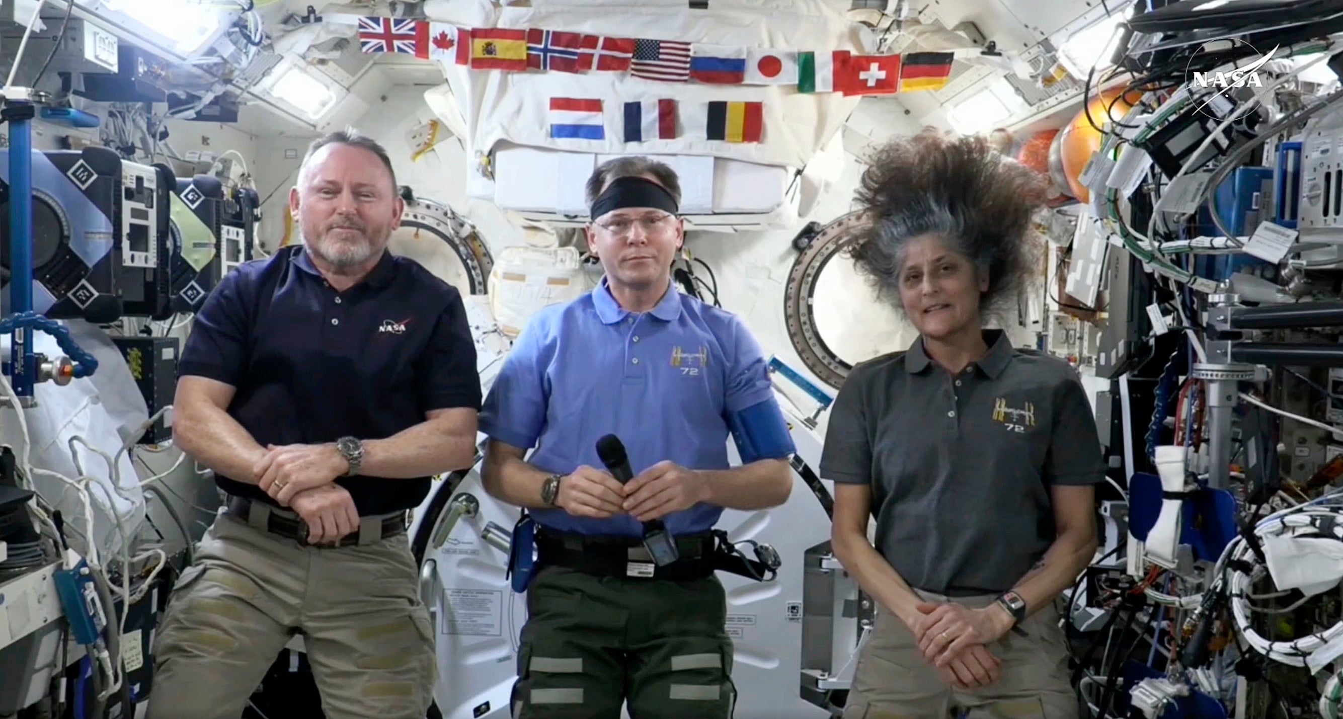 Butch Wilmore, Nick Hague and Suni Williams speaking during a news conference on March 4