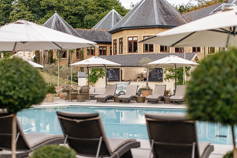The outdoor pool is the star of the show at Pennyhill Park Hotel and Spa