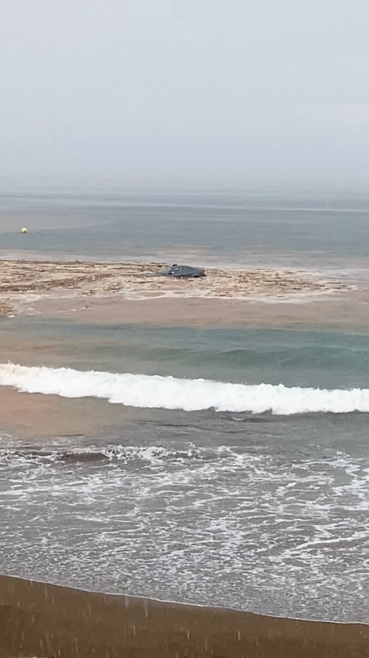 A car is dragged into the sea off Salinetas beach