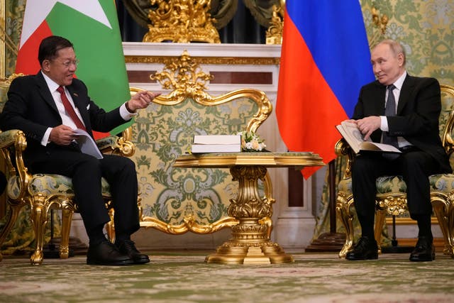 <p>Russian President Vladimir Putin, right, and Myanmar's Military leader Senior Gen. Min Aung Hlaing talk during their meeting at the Grand Kremlin Palace in Moscow, Russia, Tuesday</p>