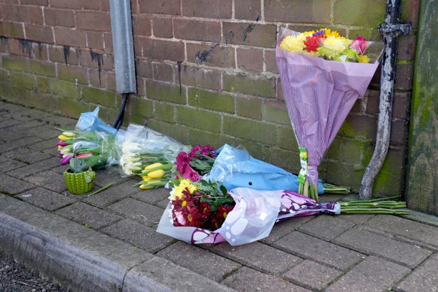 Floral tributes near the scene in Paradise Road, Clapham, south London, where a 16-year-old boy died after being shot on Tuesday (Lucy North/PA)