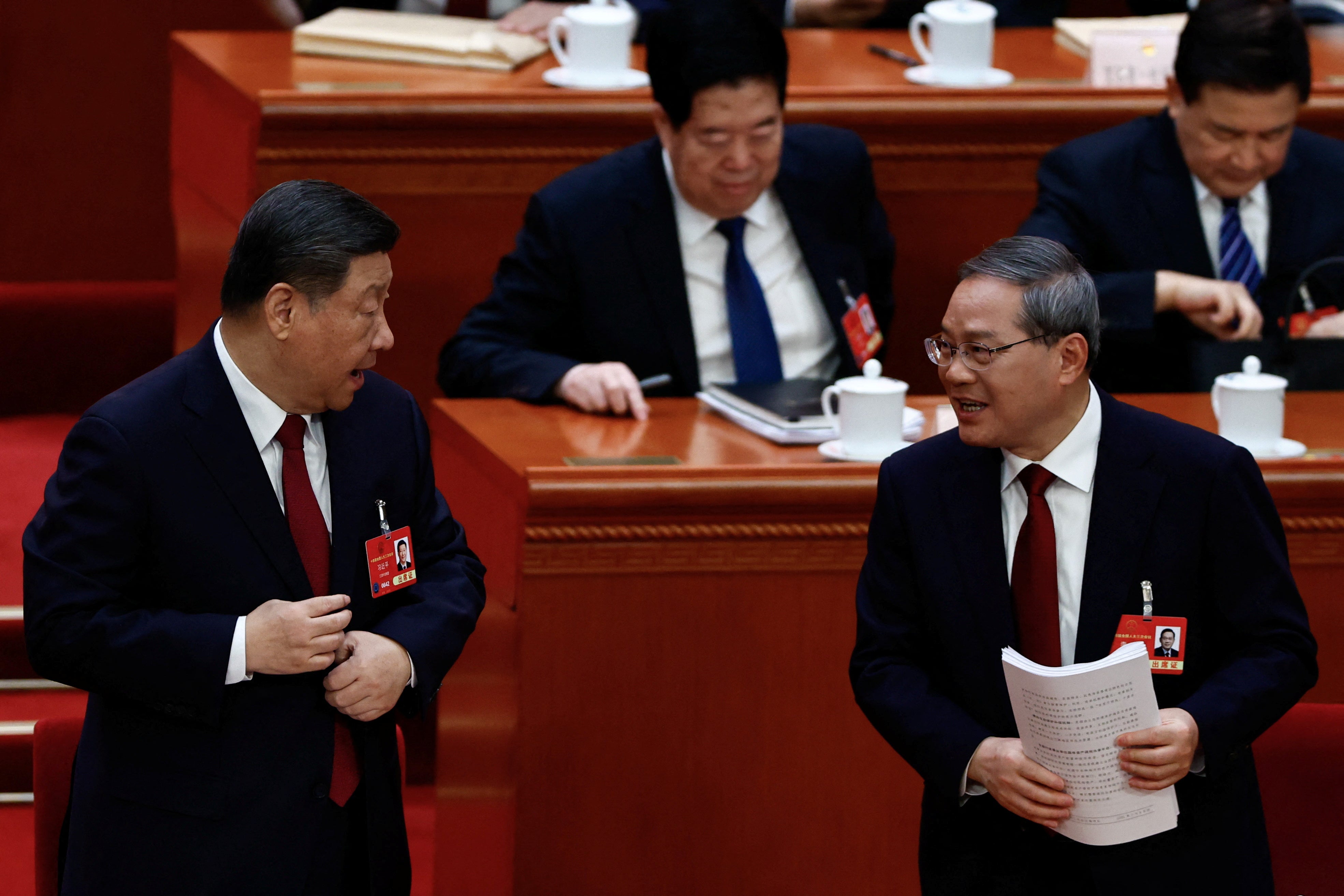 Chinese president Xi Jinping and premier Li Qiang attend the opening session of the National People's Congress