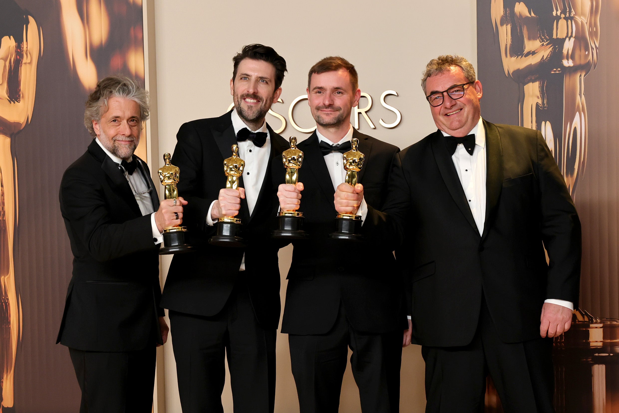 (L-R) Paul Lambert, Stephen James, Rhys Salcombe, and Gerd Nefzer, winners of the best visual effects award for Dune Part Two at the Oscars