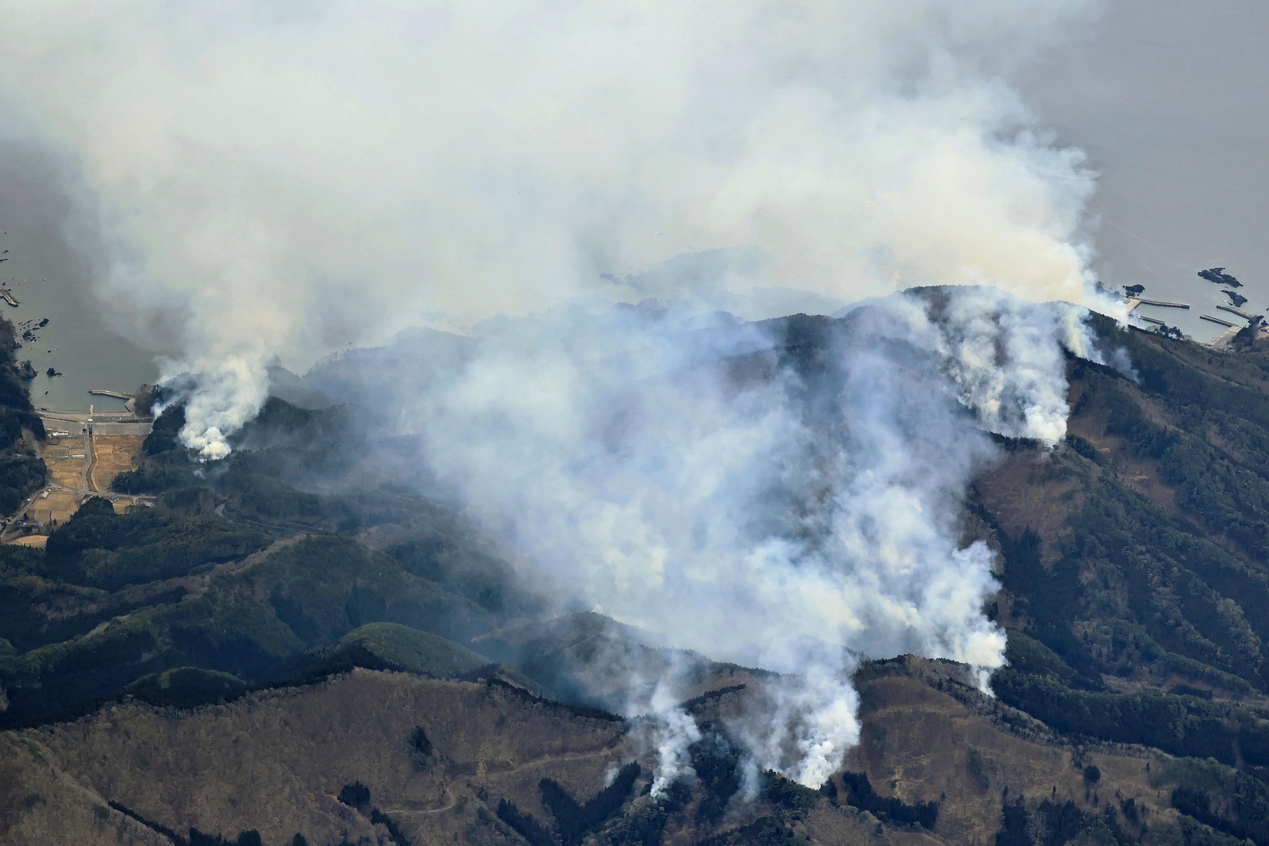 An air builder shows an extensive forest fire that began last Wednesday in Ofunato