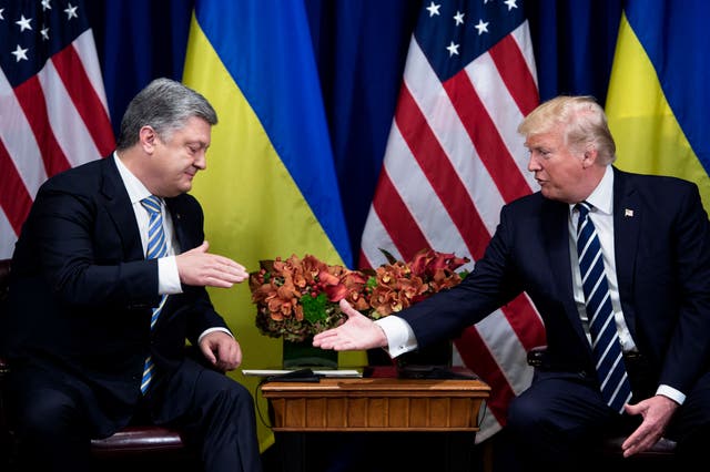 <p>File: US president Donald Trump and former Ukraine president Petro Poroshenko shake hands</p>