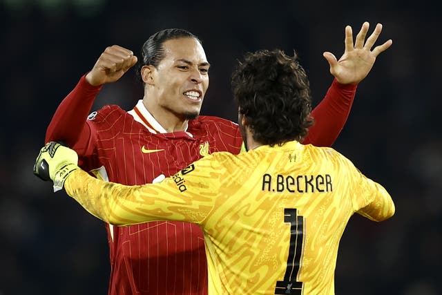 <p>Virgil van Dijk and Alisson celebrate Liverpool's 1-0 win over PSG</p>