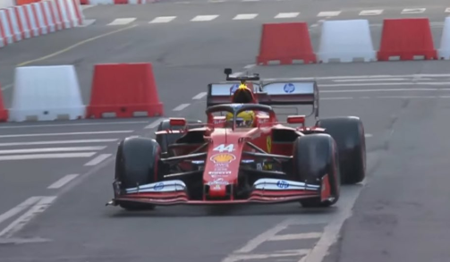 Lewis Hamilton drives a 2021 Ferrari car on the streets of Milan