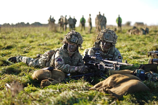 Members of the Welsh Guards prepare a general-purpose machine gun (Aaron Chown/PA)