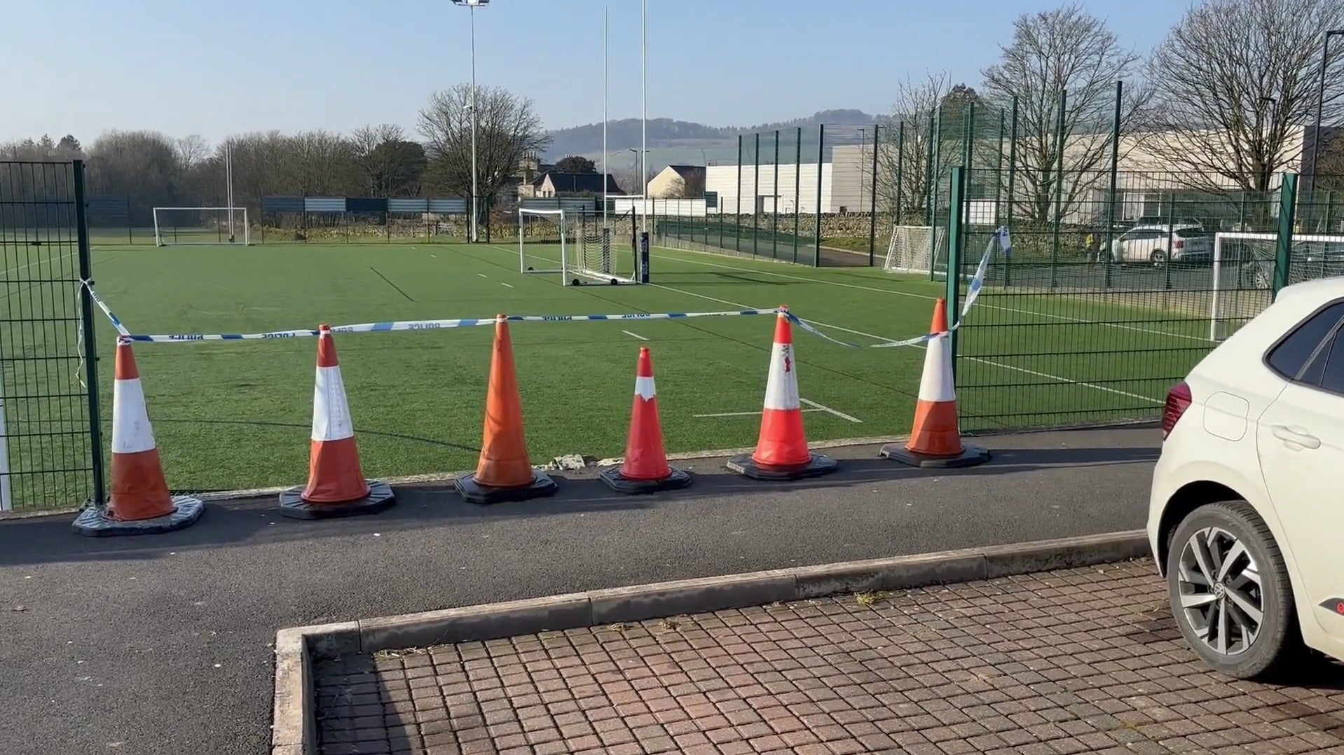 The aftermath of the crash shows a gap in the protective fence the black BMW smashed through