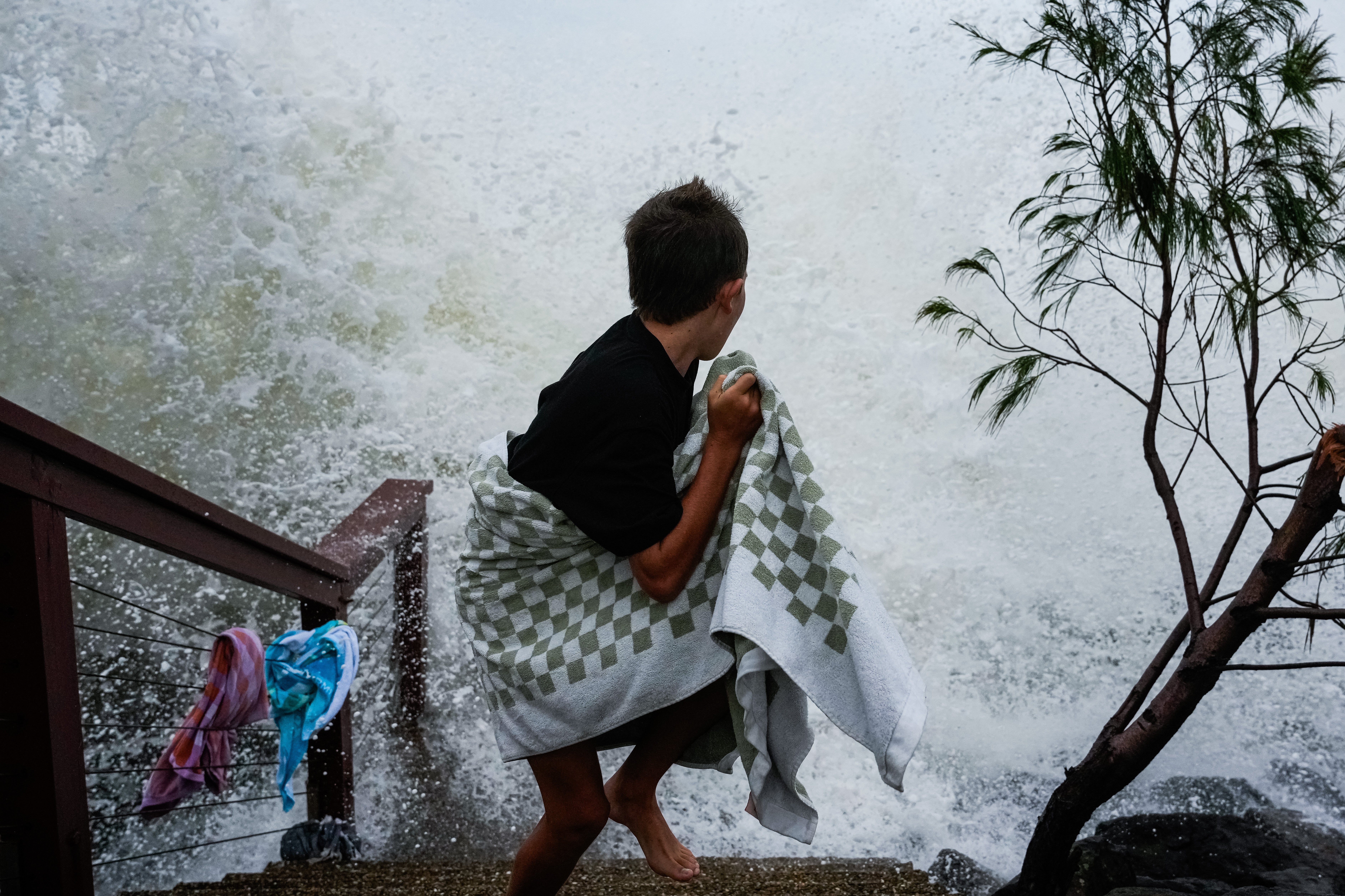 An onlooker evades a incoming wave on 6 March 2025