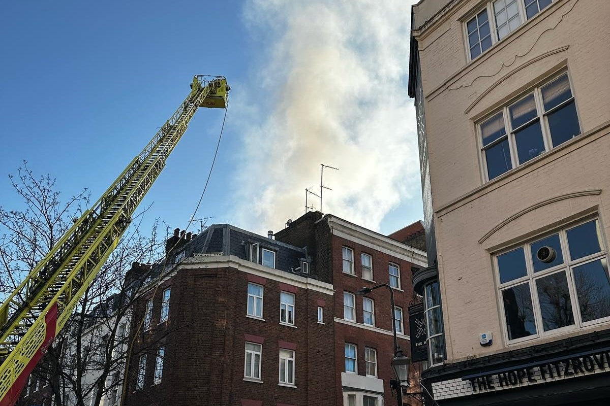 Man in hospital after being pulled from flames in central London fire Man in hospital after being pulled from flames in central London fire