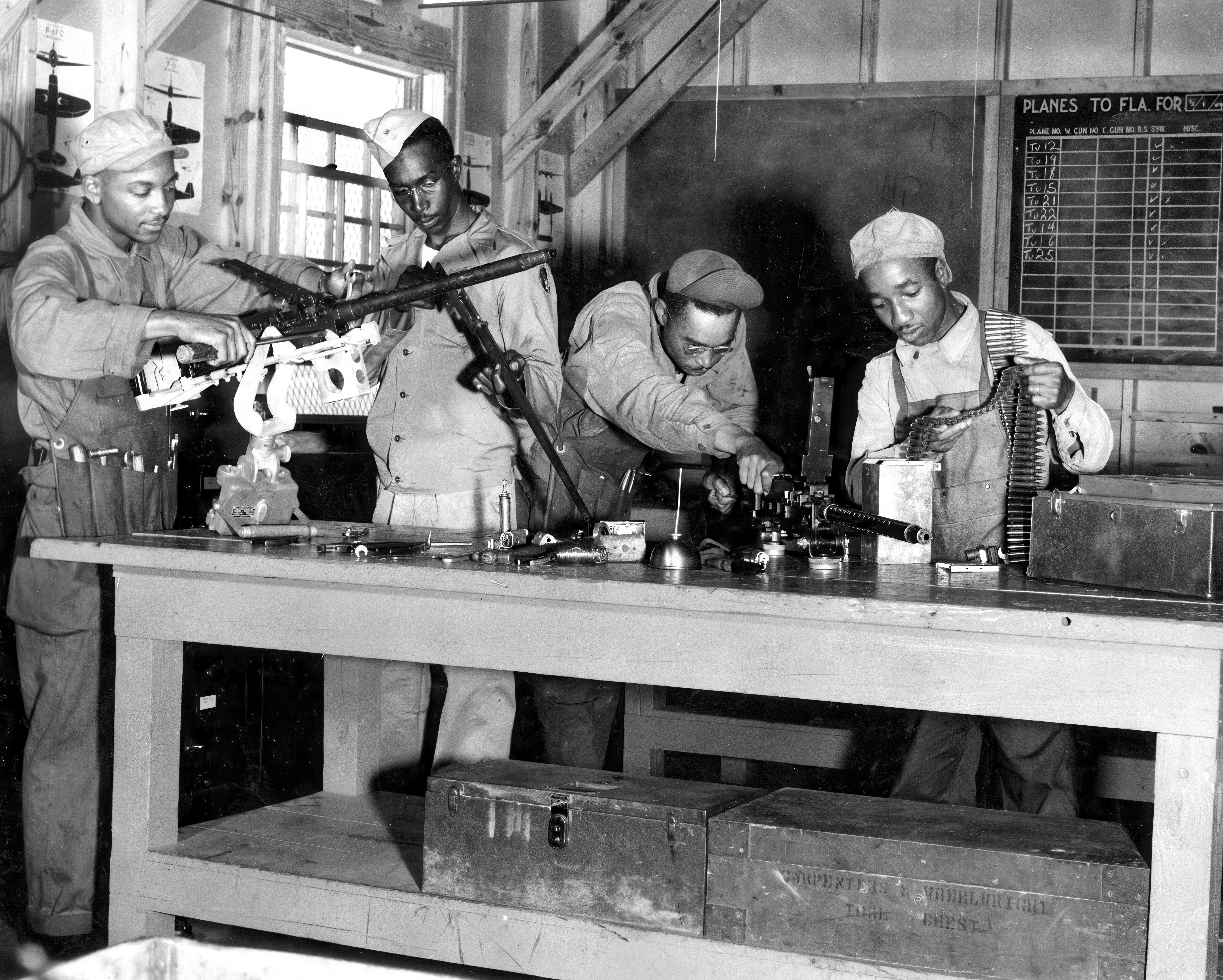 This Air Force photo of Black armorers and other ground personnel going through training at Chanute Field, Ill., during World War II is the type of photo marked for deletion by the Pentagon in its DEI eradication