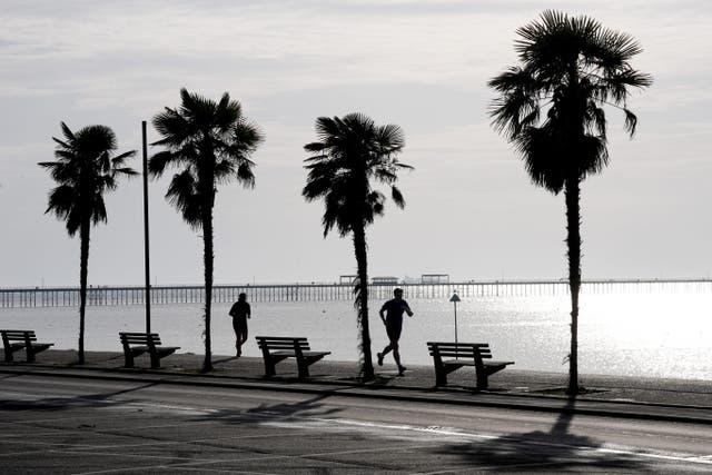 <p>Joggers enjoyed a calm start to Friday in Southend-on-Sea, Essex</p>