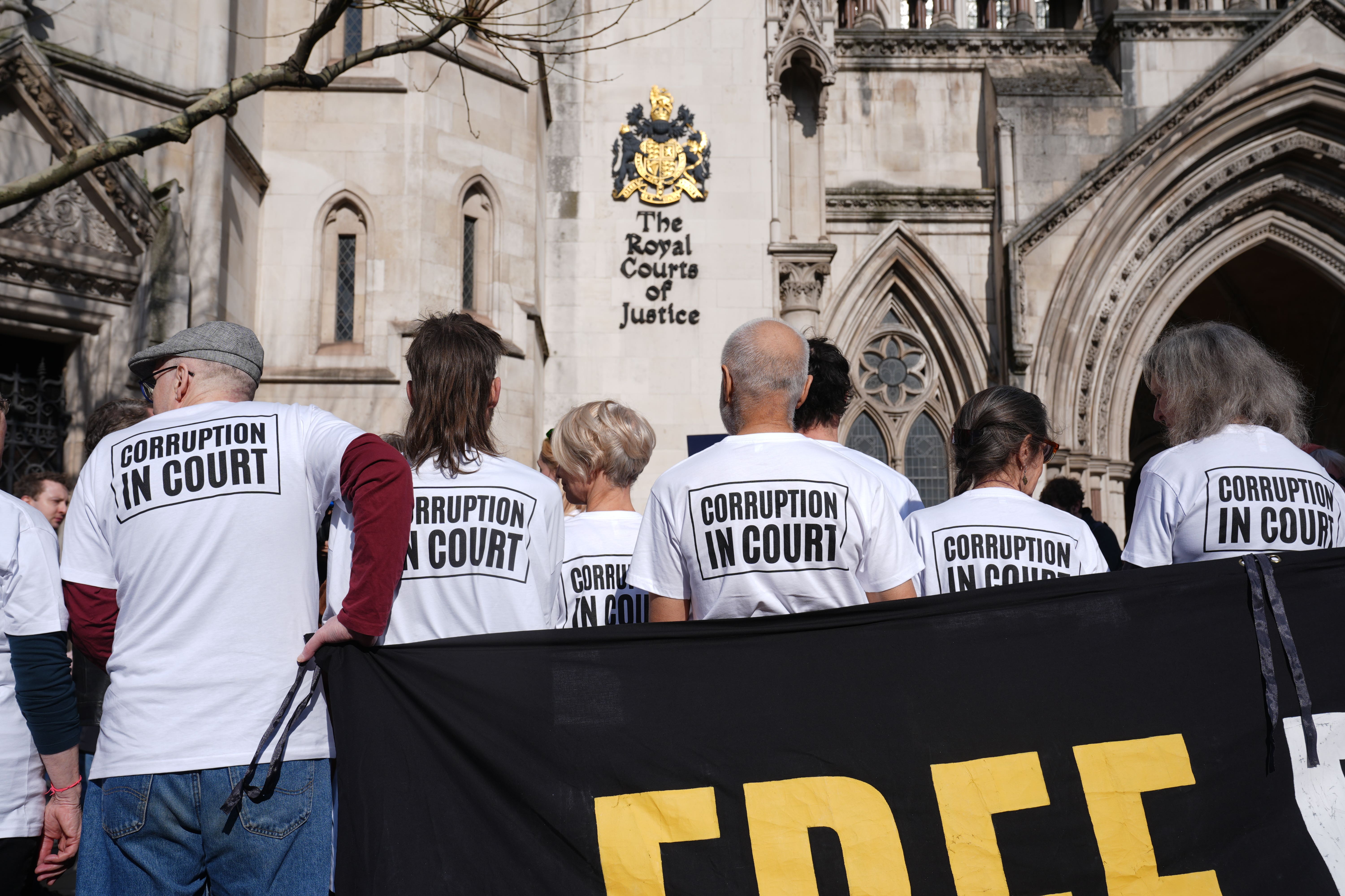 Just Stop Oil campaigners outside the Court of Appeal at the Royal Courts of Justice, central London, on Friday (Lucy North/PA)