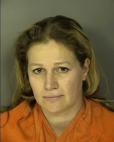 <p>South Carolina Forestry Commission law enforcement officials arrested Alexandra Bialousow, 40, of Myrtle Beach on Thursday on two charges related to the escape of a residential yard debris burn that is alleged to have ignited the Carolina Forest Fire near Myrtle Beach. The blaze spread over 2,059 acres</p>