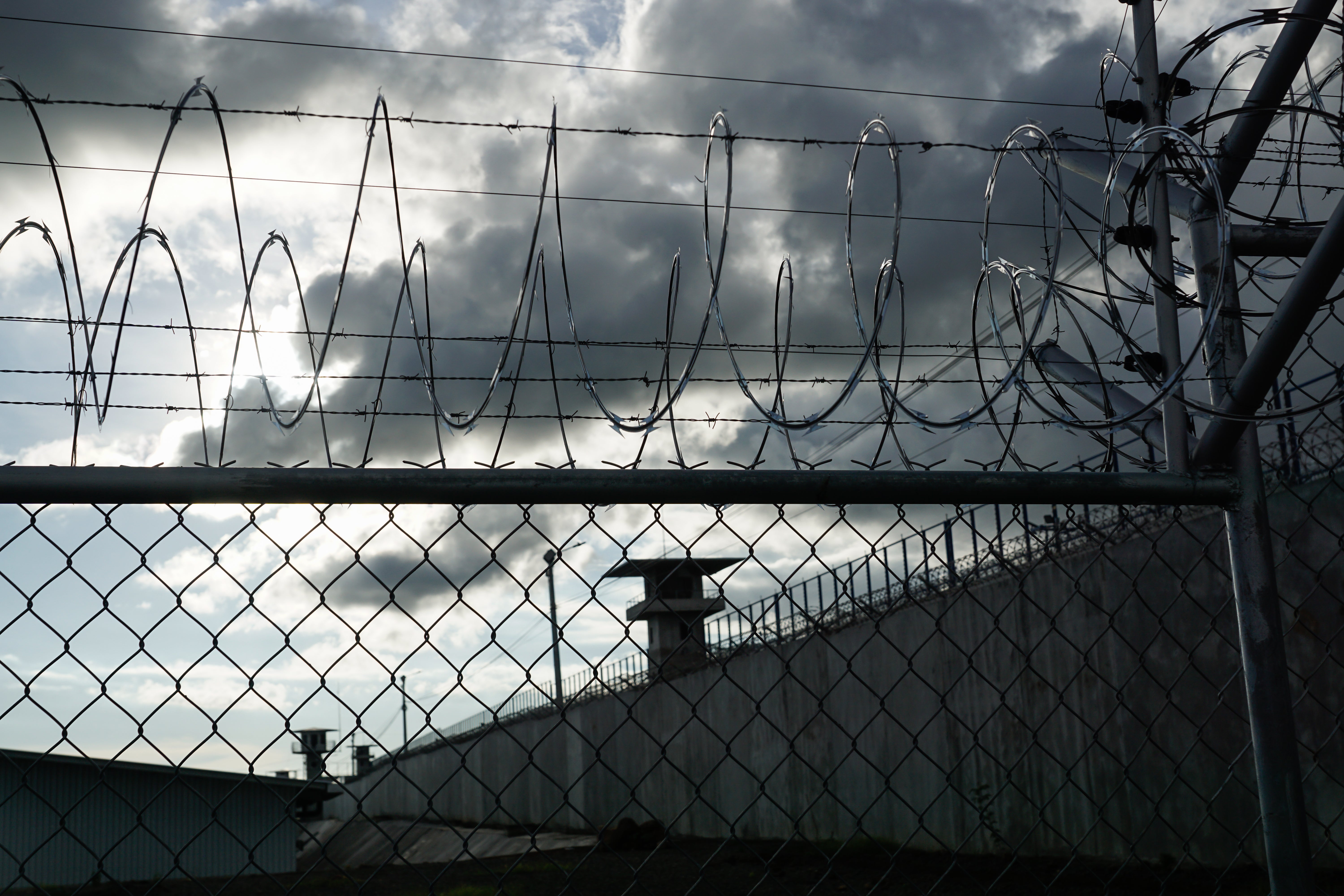 Watchtowers and barbed wire at CECOT