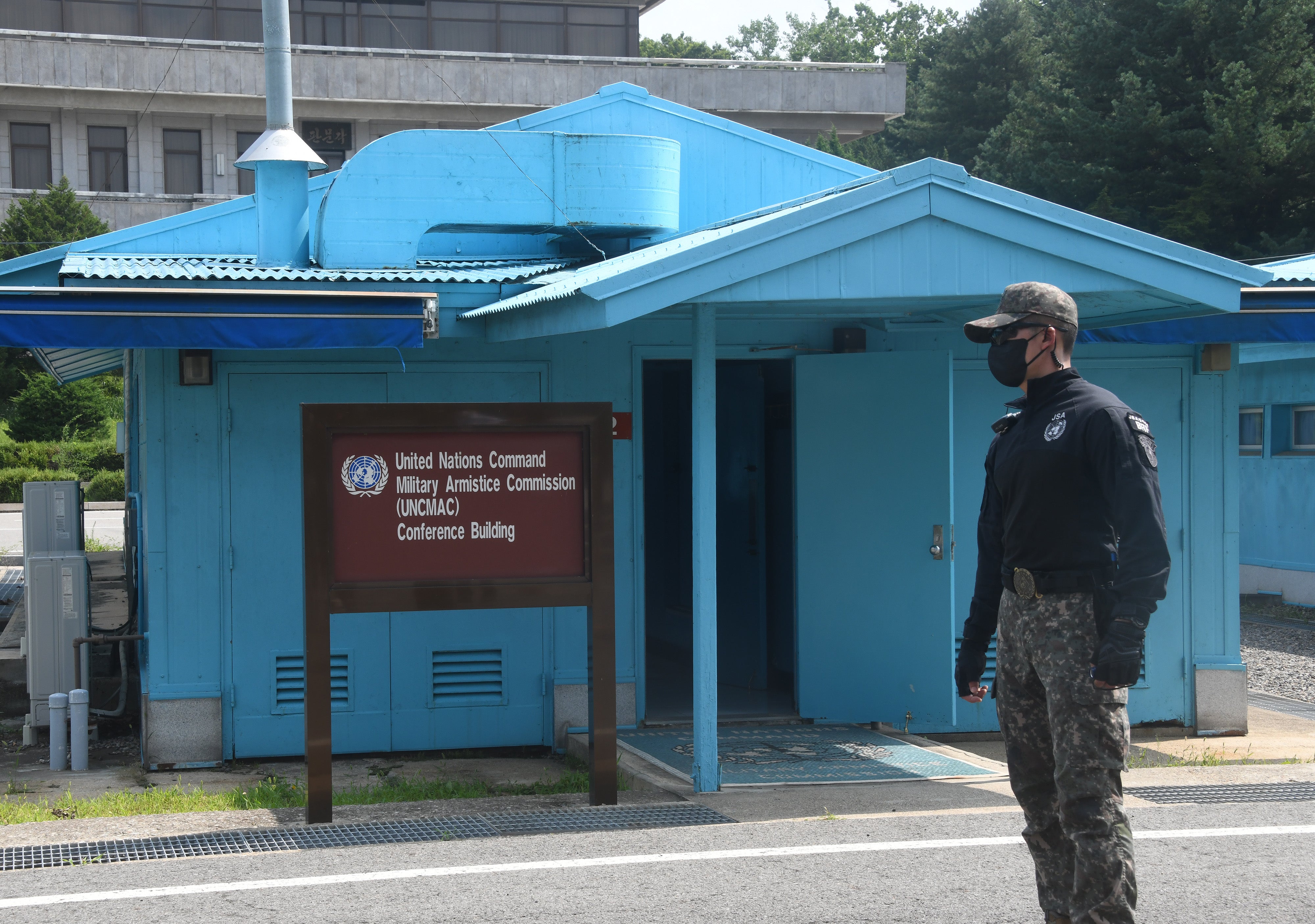 File: A South Korean stands guard in the truce village of Panmunjom inside the demilitarized zone (DMZ) separating the South and North Korea