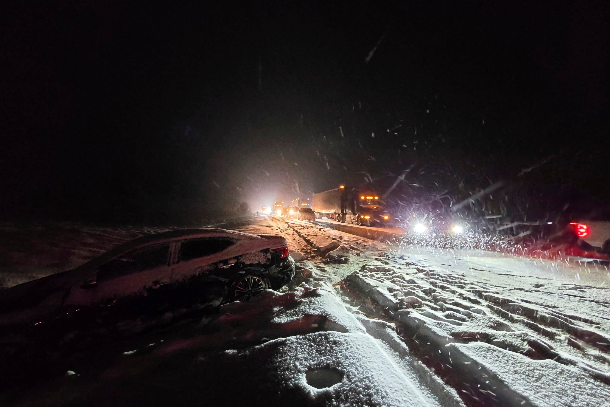 Cars sit in traffic backed up for miles on Arizona’s Interstate 40 after a fresh dumping of snow