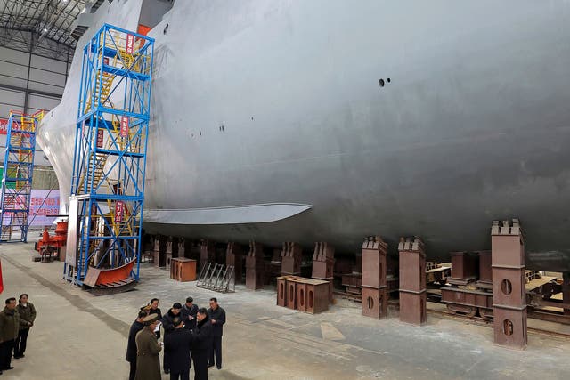 <p>North Korean leader Kim Jong Un, bottom right, visits a shipyard to construct warships at an undisclosed place in North Korea</p>