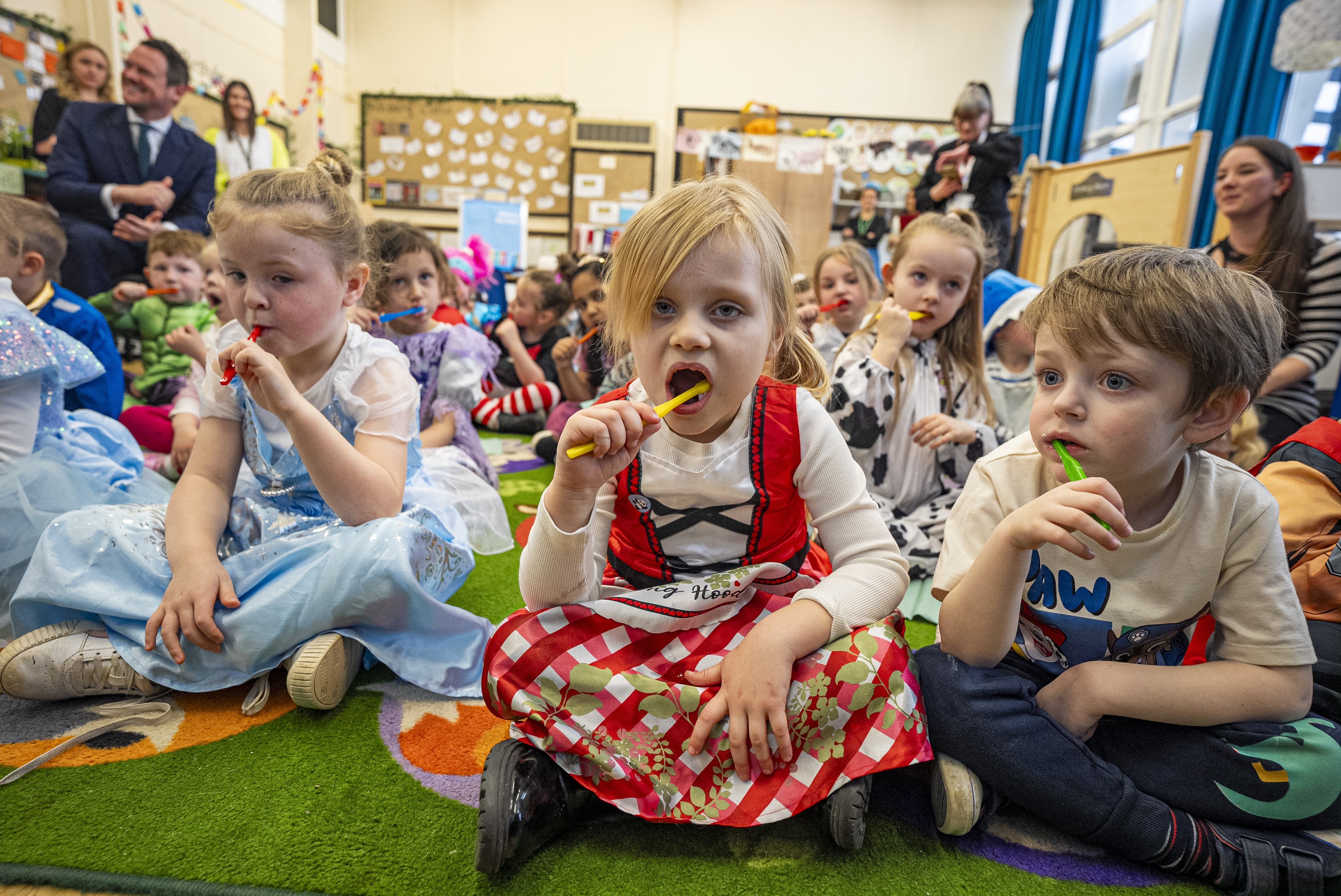 Children at school brush their teeth for two minutes inside a classroom at Fair Furlong primary school in Bristol. Children should brush their teeth twice a day under the new school preparation guidelines for parents.