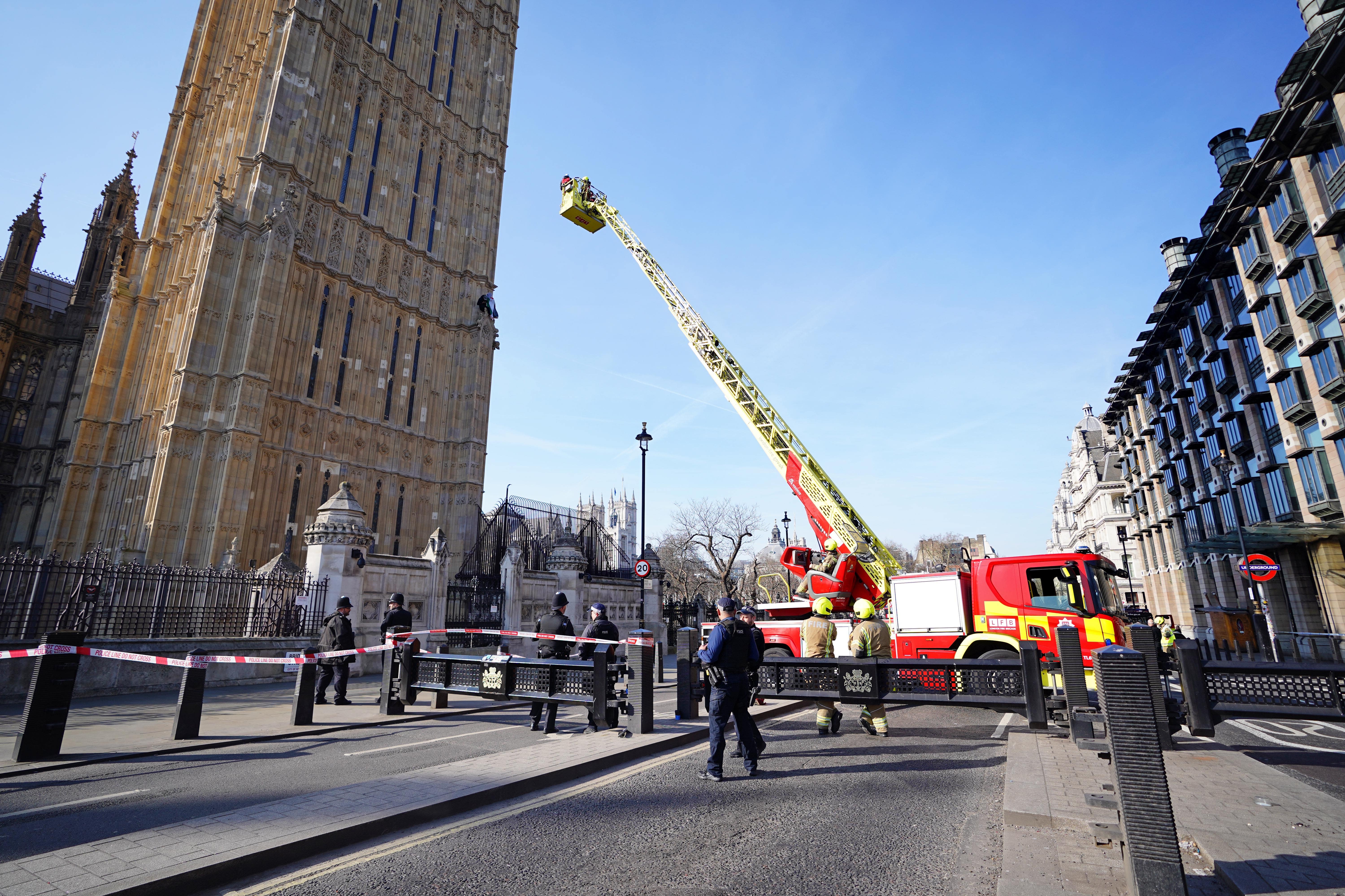 Emergency services at the Palace of Westminster in London after man with a Palestine flag climbed up Elizabeth Tower, which houses Big Ben